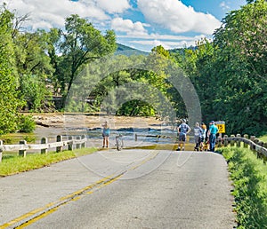 People Viewing the Raging Roanoke River